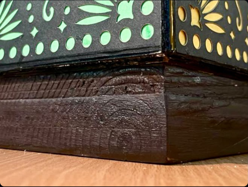 Close-up of the folded base doubling as the plinth