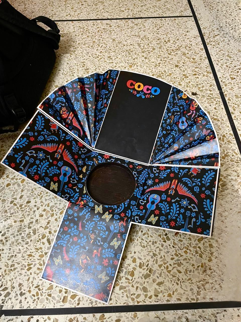 The printed fan net, cut and laid flat before it is folded to stand