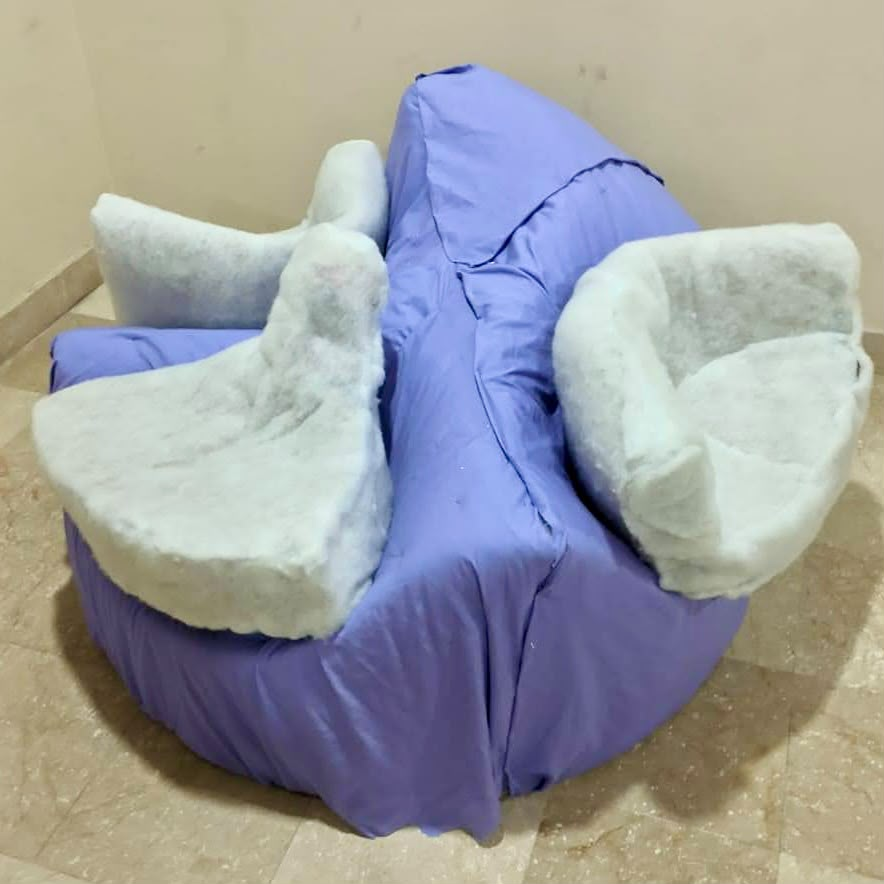 Purple cover fitted over the base with seats still in white batting