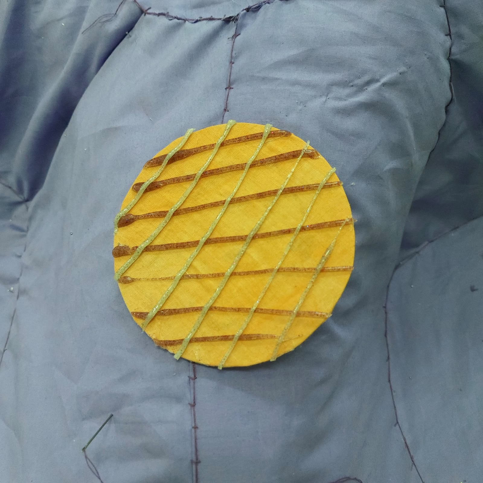 Yellow patch with raised diagonal ridges