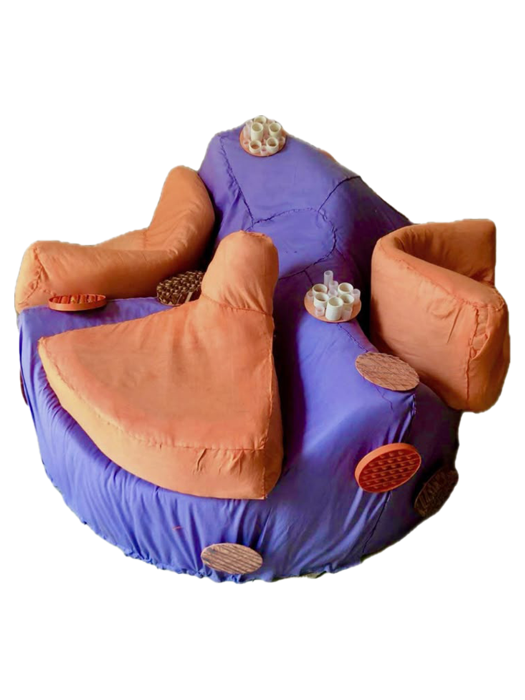 The finished Globy prototype, three orange seats on a purple base with sensory patches