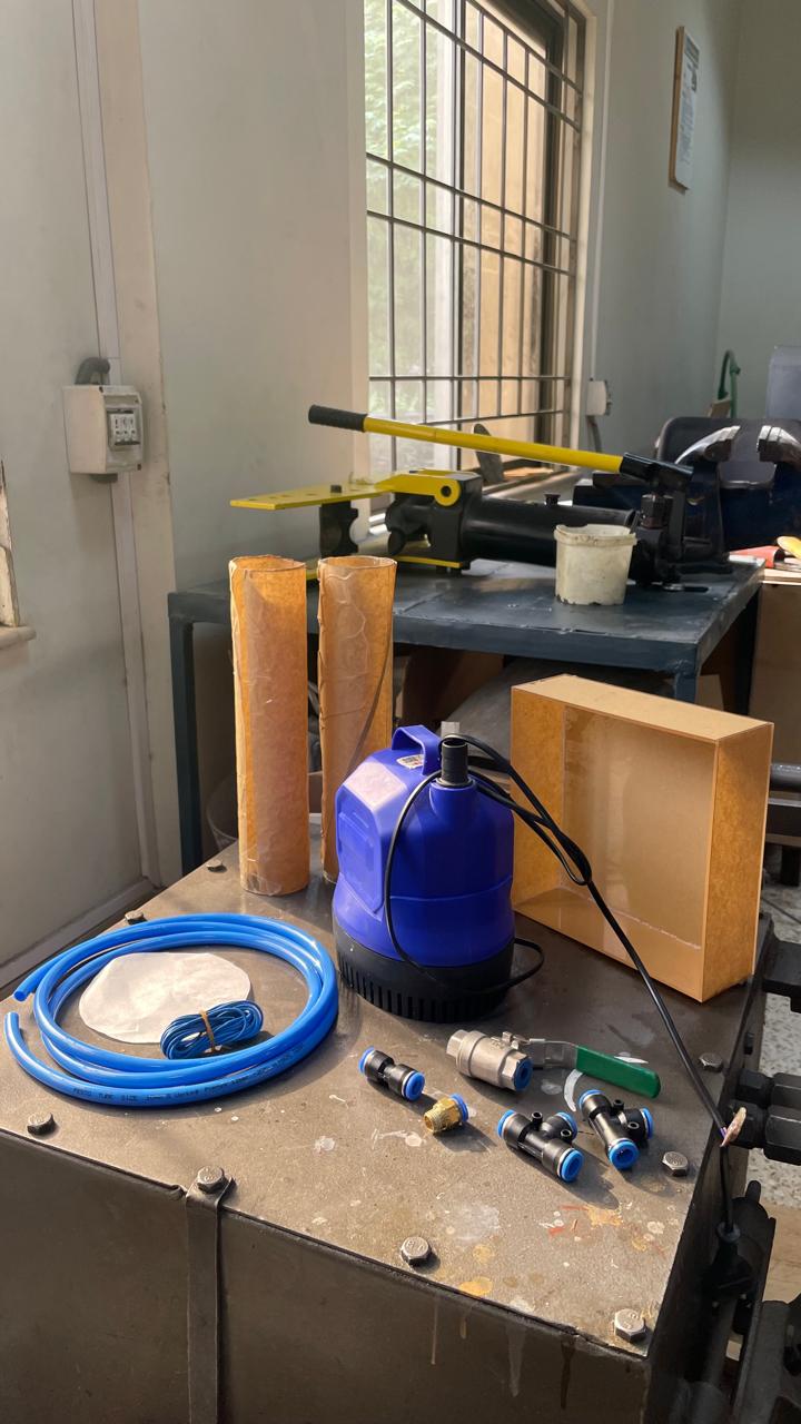 Submersible pump and tubing on a bench