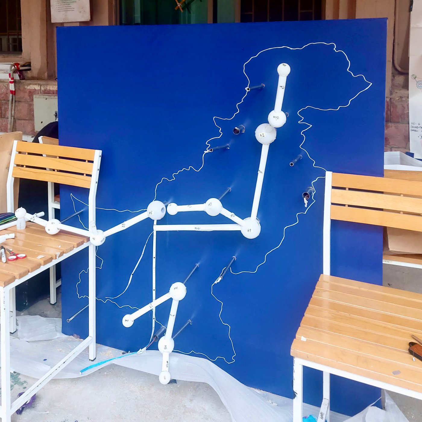 Blue panel with the map outline and part of the network dry-fitted