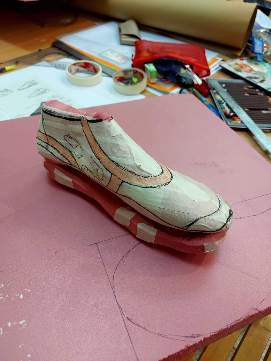 Upper drawn onto the taped last